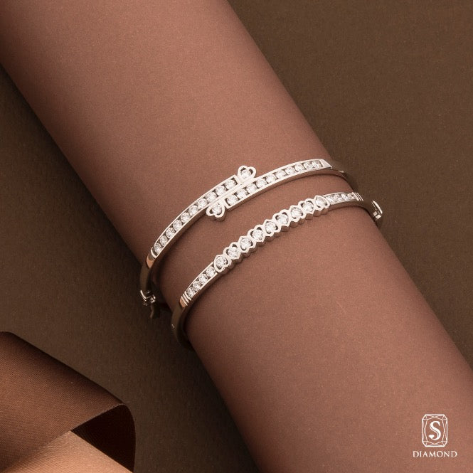 Romantic bypassed double-heart diamond bangle and channel-set interlocking heart bracelet by S.Diamond