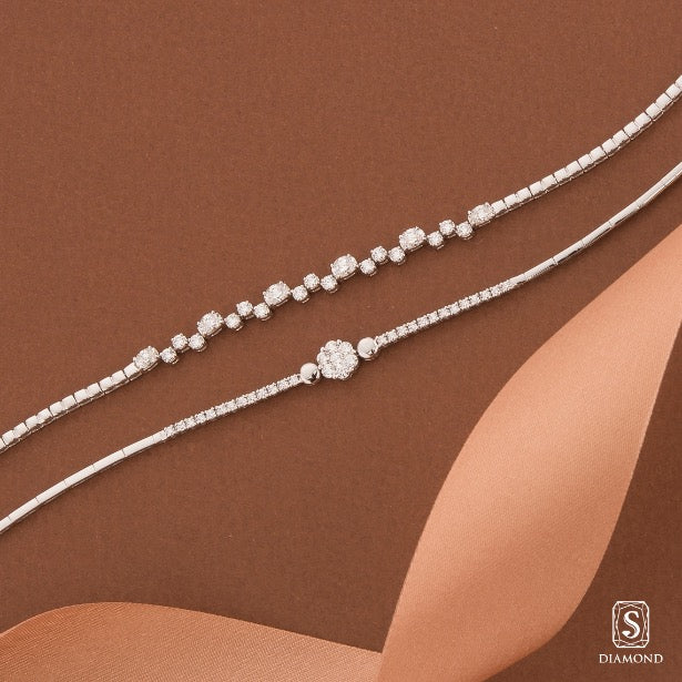 Charming oval shape diamond tennis bracelet and luxury multi-row illusion-set diamond bracelet stack by S.Diamond