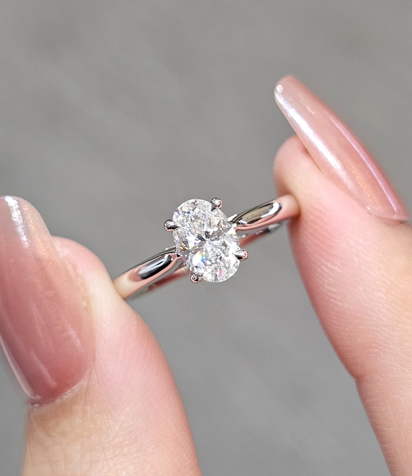 Oval Cut natural diamond engagement ring close up showing solitaire setting by S.Diamond