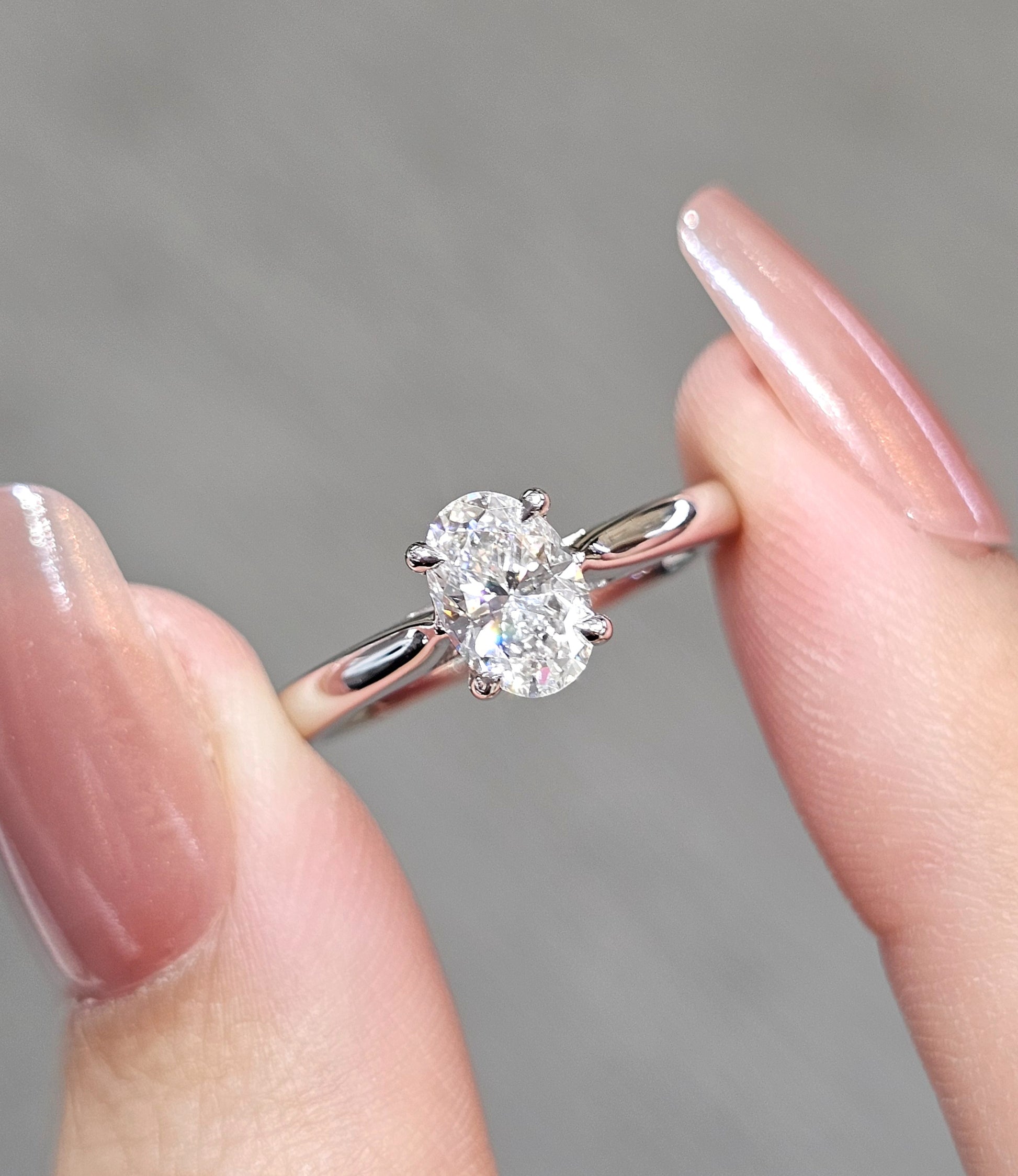 Oval Cut natural diamond engagement ring close up showing solitaire setting by S.Diamond