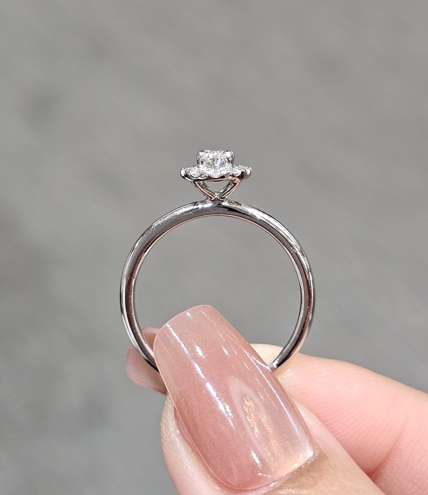 Oval Cut Diamond Graduated Side-Stone Engagement Ring
