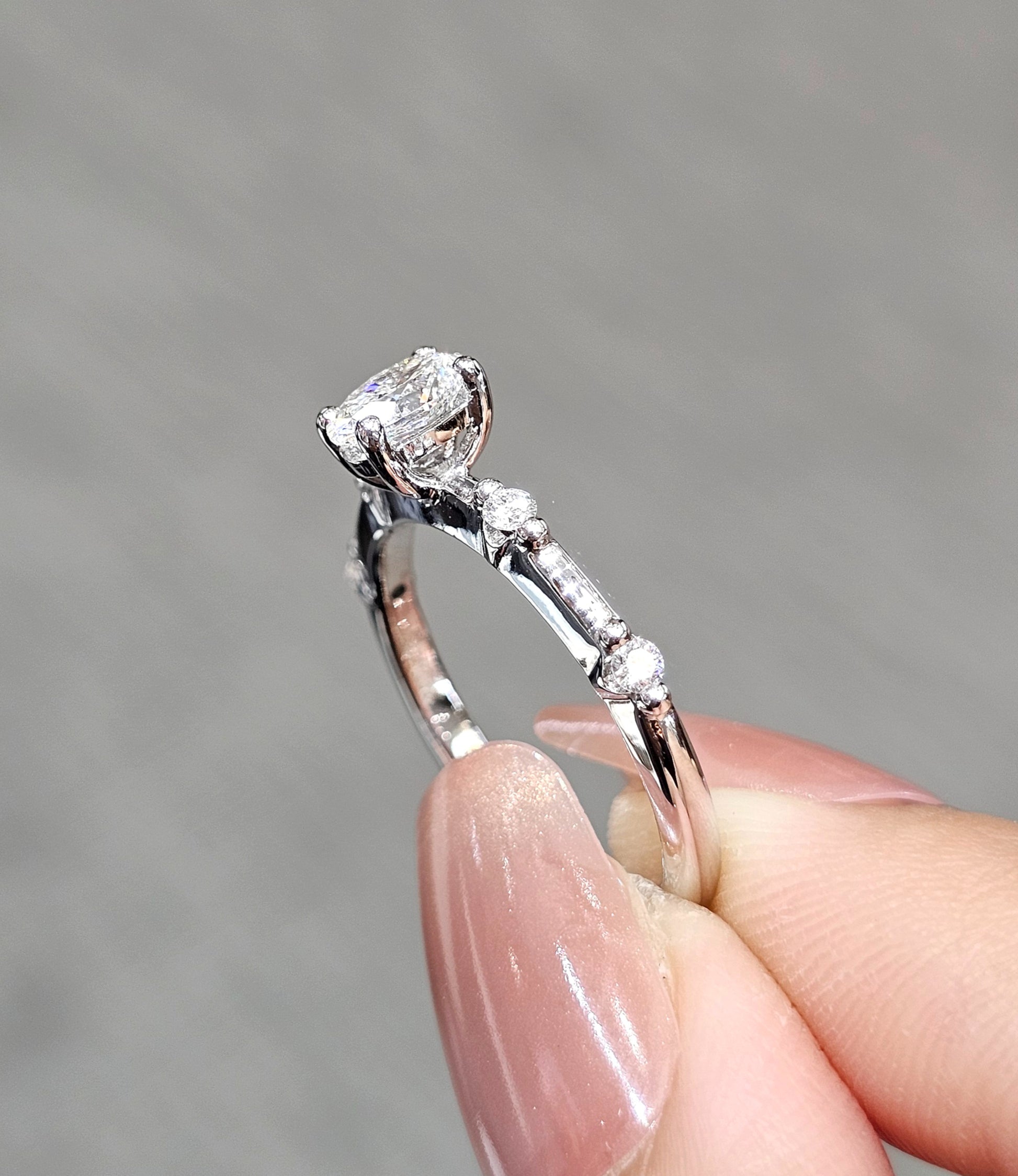 Side profile Oval Cut natural diamond side-stone engagement ring by S.Diamond Bangkok