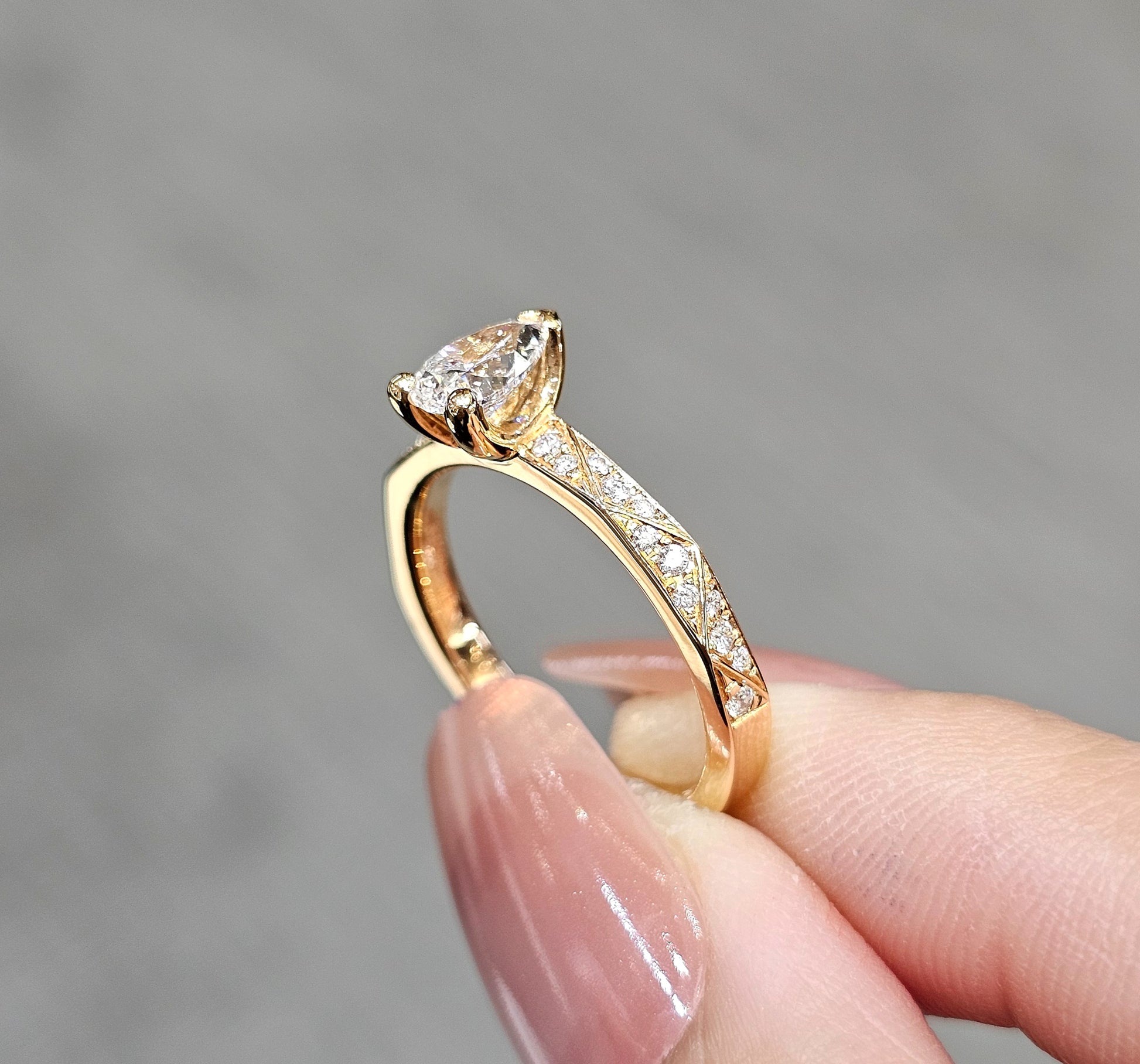 pink gold ring engagement four prong on hand 