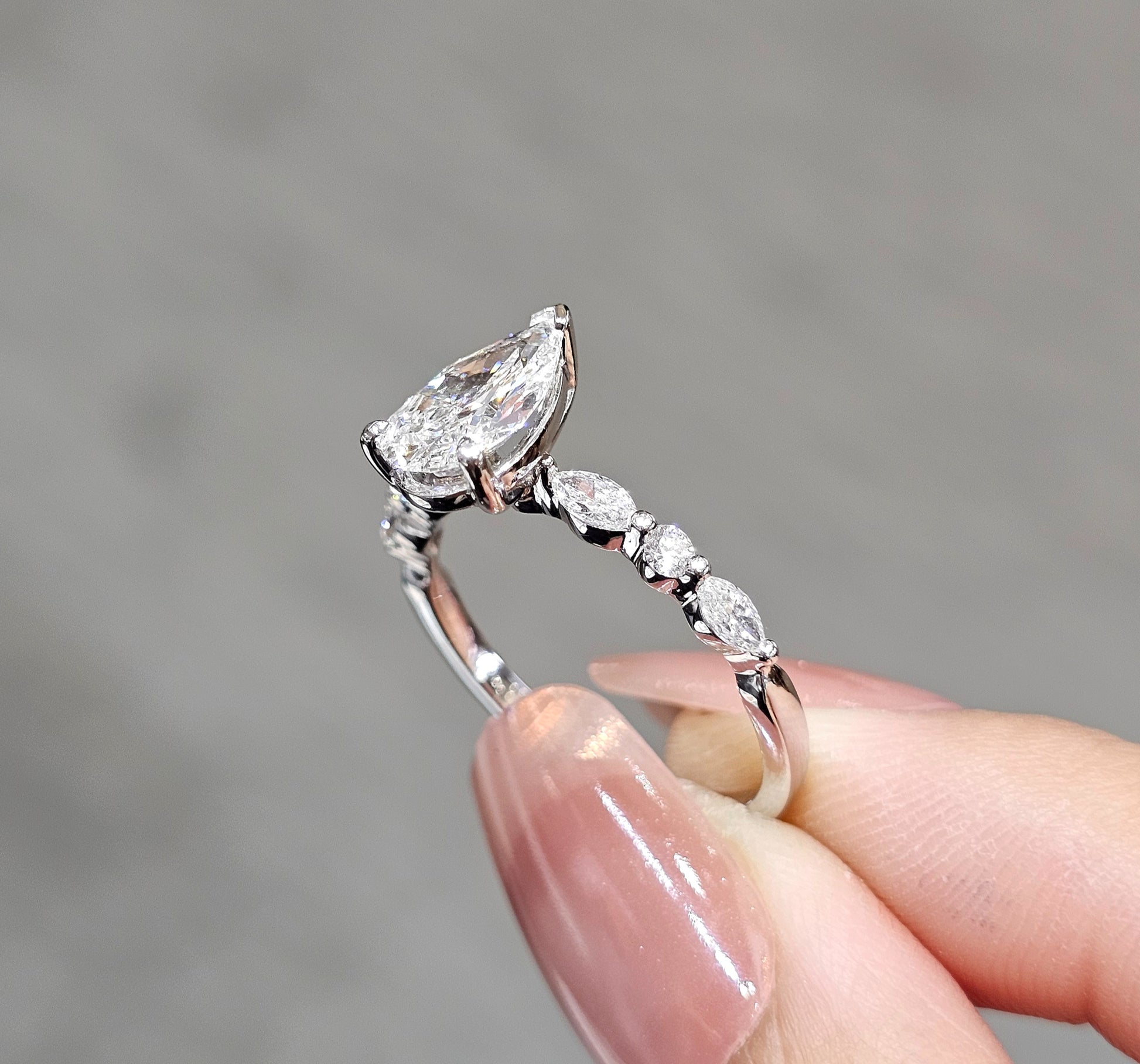 Pear Cut natural diamond engagement ring with graduated Marquise side diamonds by S.Diamond Bangkok