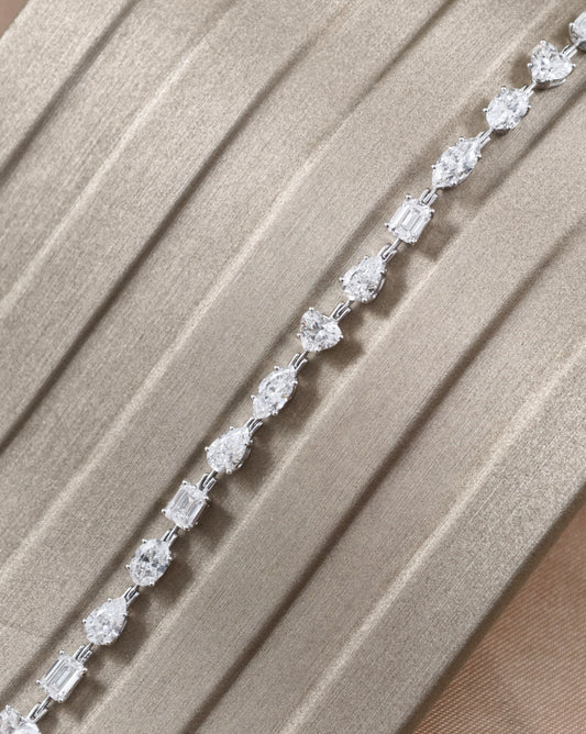 Mixed shape natural diamond tennis bracelet with emerald pear heart oval and marquise diamonds