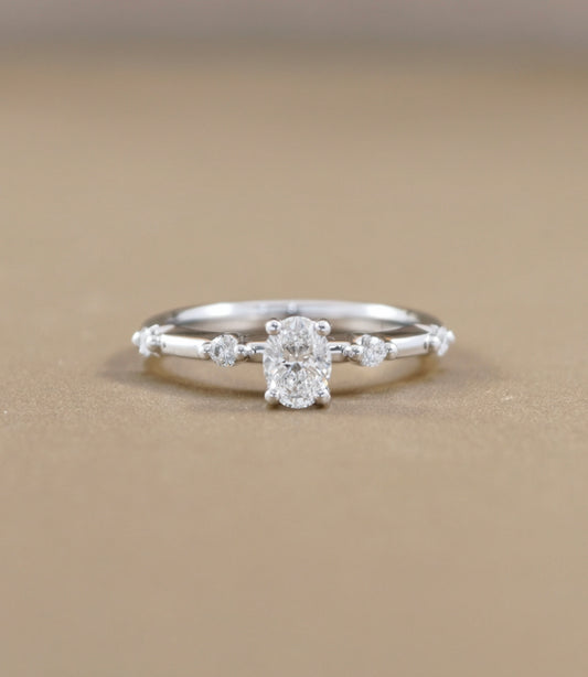 Oval Cut natural diamond graduated side-stone engagement ring in white gold by S.Diamond Bangkok