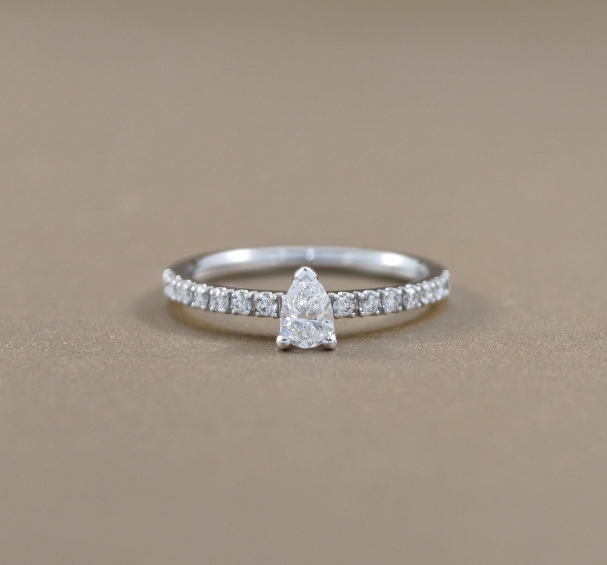 Pear Cut natural diamond classic pavé solitaire engagement ring in white gold by S.Diamond Bangkok