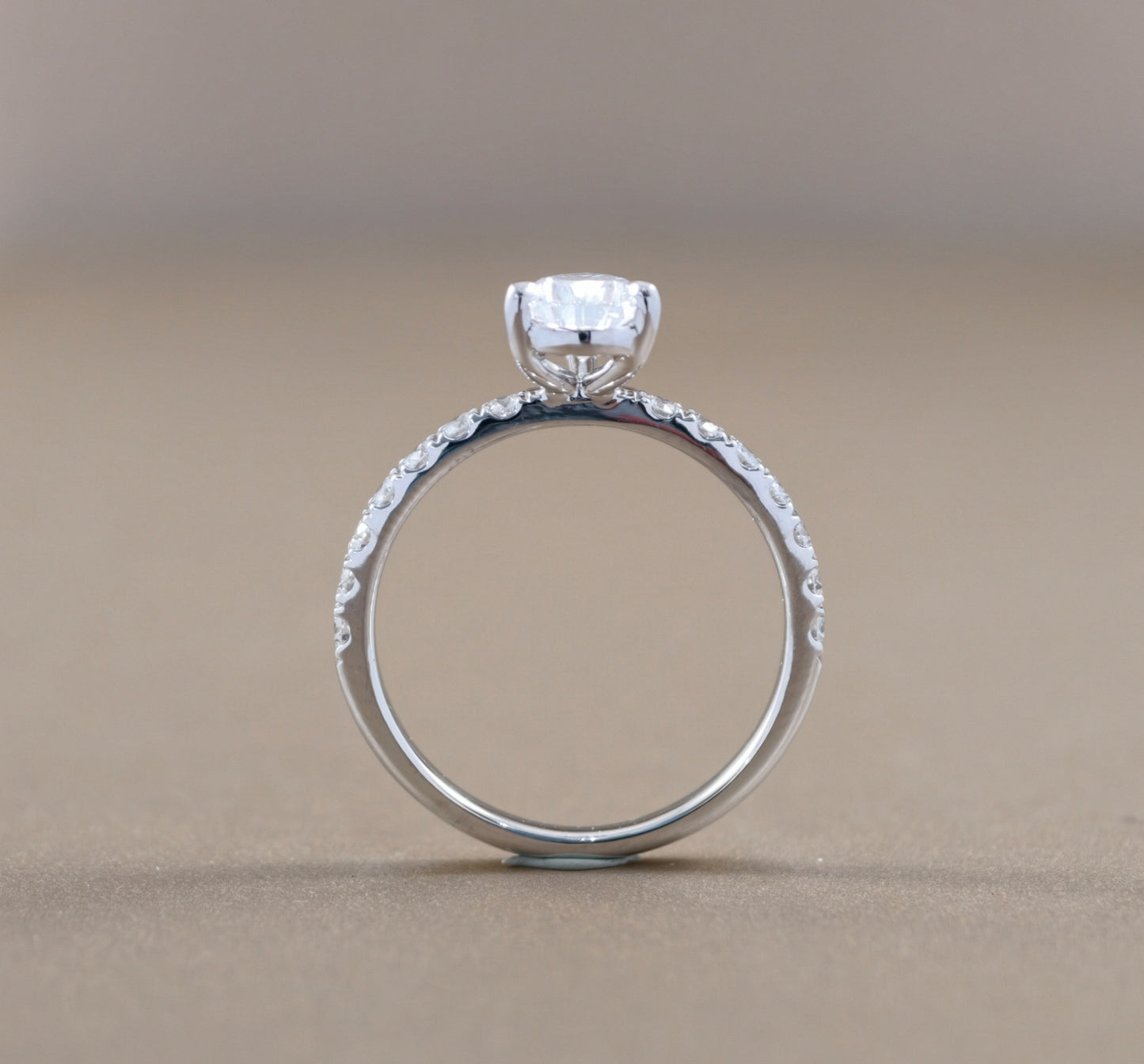 Side profile Pear Cut diamond Cathedral Pavé engagement ring by S.Diamond