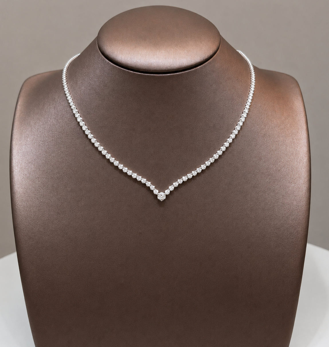The Royal Cascade Diamond Necklace featuring a GIA certified natural diamond tennis necklace with geometric drop pendant and pear halo diamond in 18K White Gold by S.Diamond Bangkok Thailand