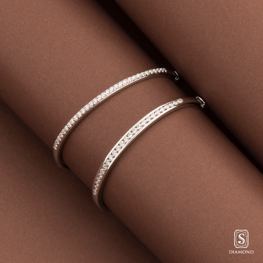 Classic single-row diamond bangle in white gold setting by S.Diamond