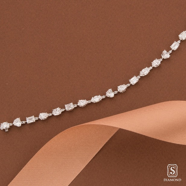 Exquisite fancy shape mixed-cut diamond tennis bracelet featuring pear, emerald, marquise, and heart cuts by S.Diamond