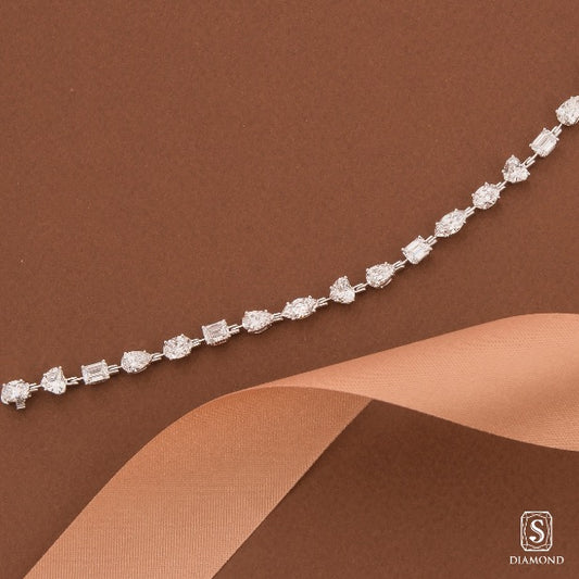 Exquisite fancy shape mixed-cut diamond tennis bracelet featuring pear, emerald, marquise, and heart cuts by S.Diamond
