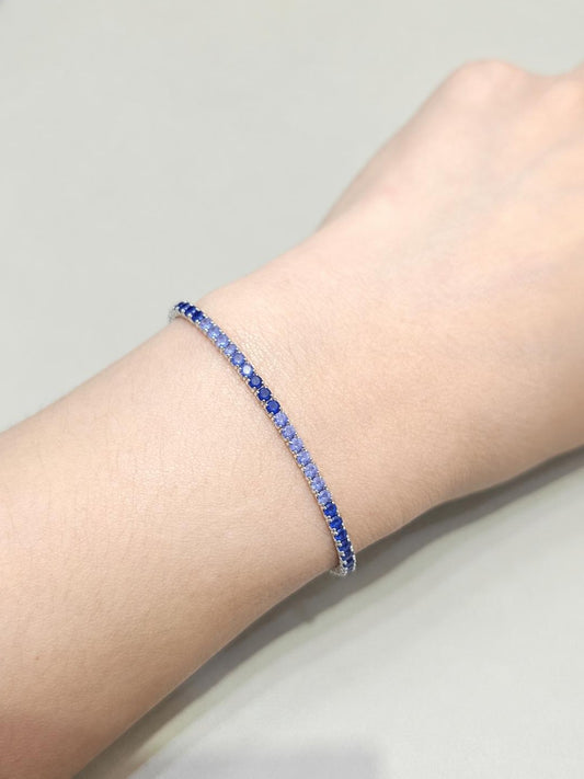 Round Cut Blue Sapphire Ombré Tennis Bracelet with gradient blue sapphires by S.Diamond